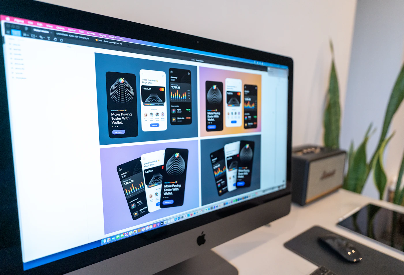 UI designs for a web and mobile product on a large monitor